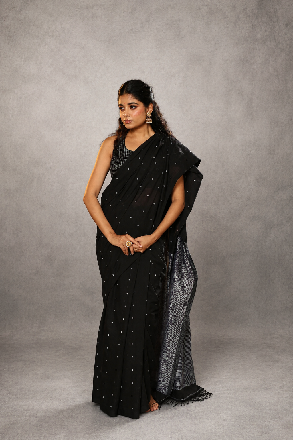 Handloom weave detail of black polka Jamdani saree