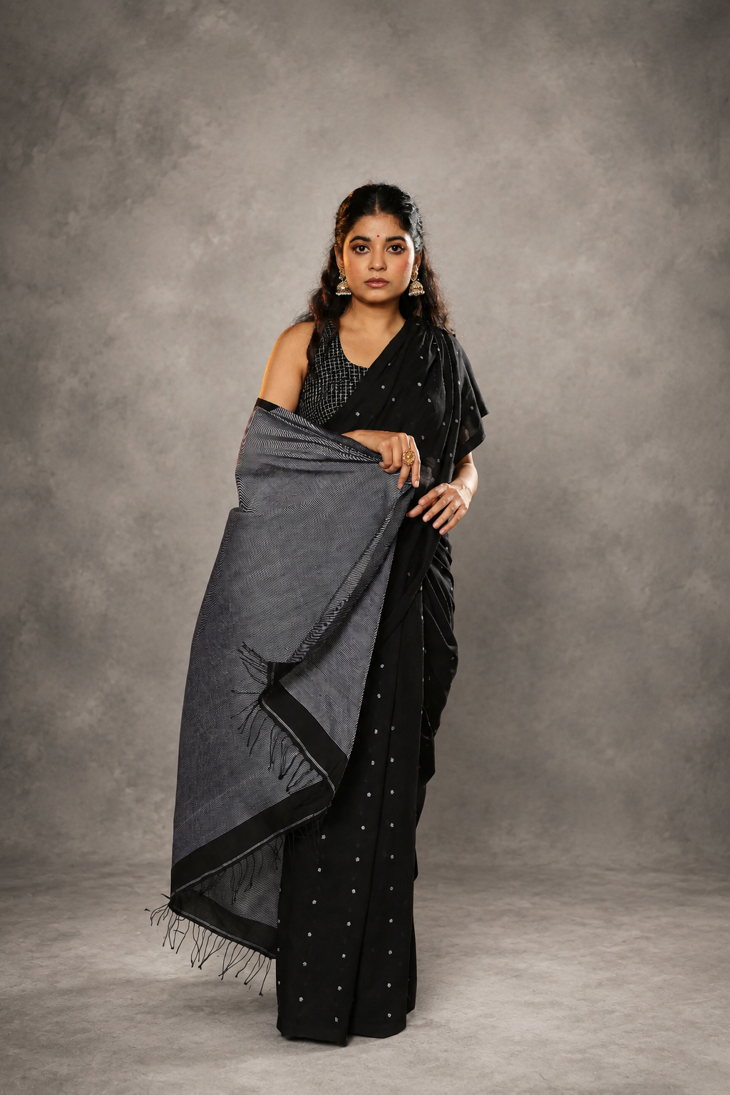 Front view of black polka pure cotton Jamdani saree