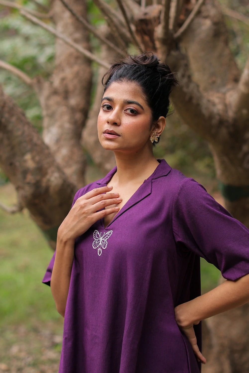 Close Up of Butterfly Silhouette and Fabric Texture on Plum Cotton Dress