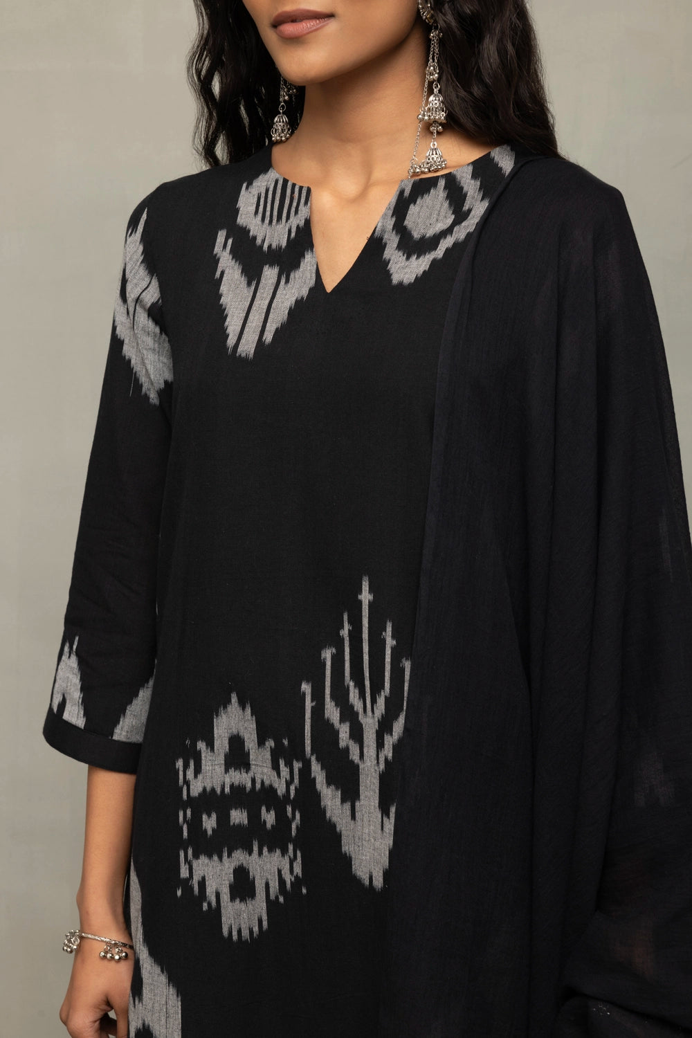 Close Up of White Abstract Motifs on Black Handloom Ikat Kurta Set