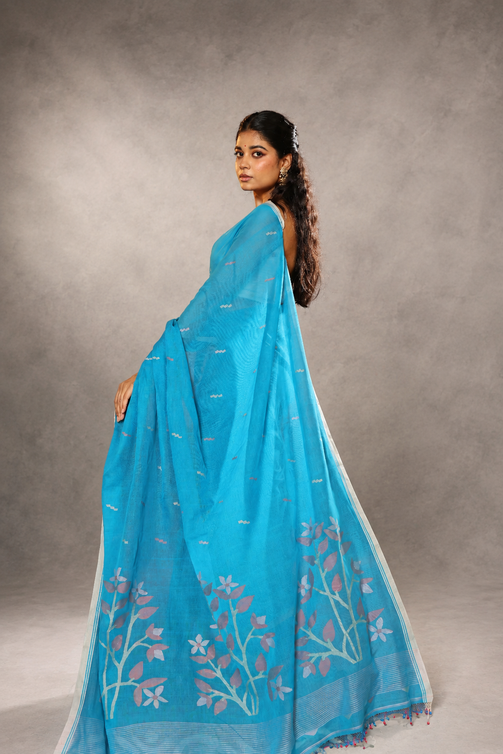 Close-up of woven details on Firozi contemporary Jamdani saree