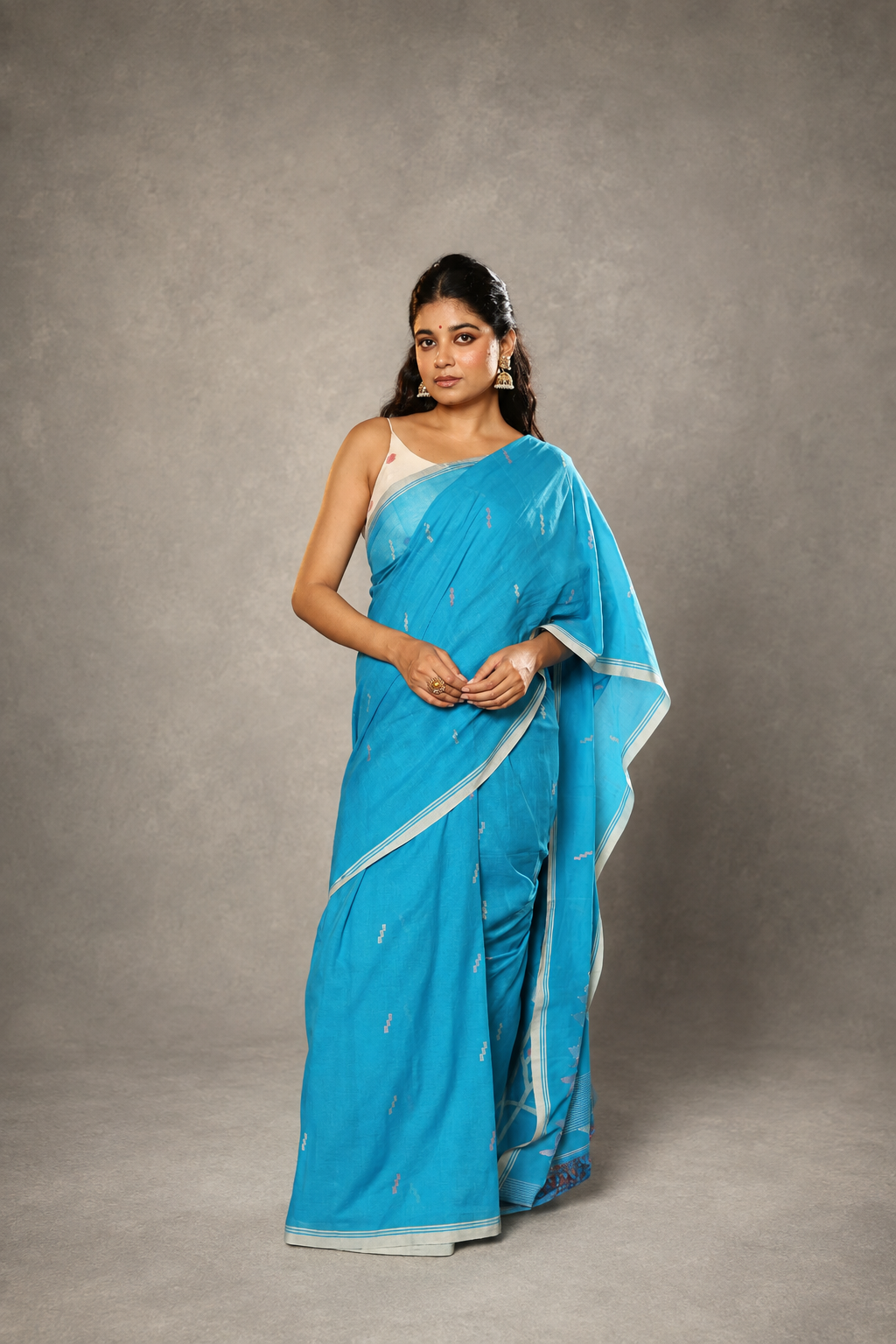 Firozi handloom cotton Jamdani saree draped elegantly