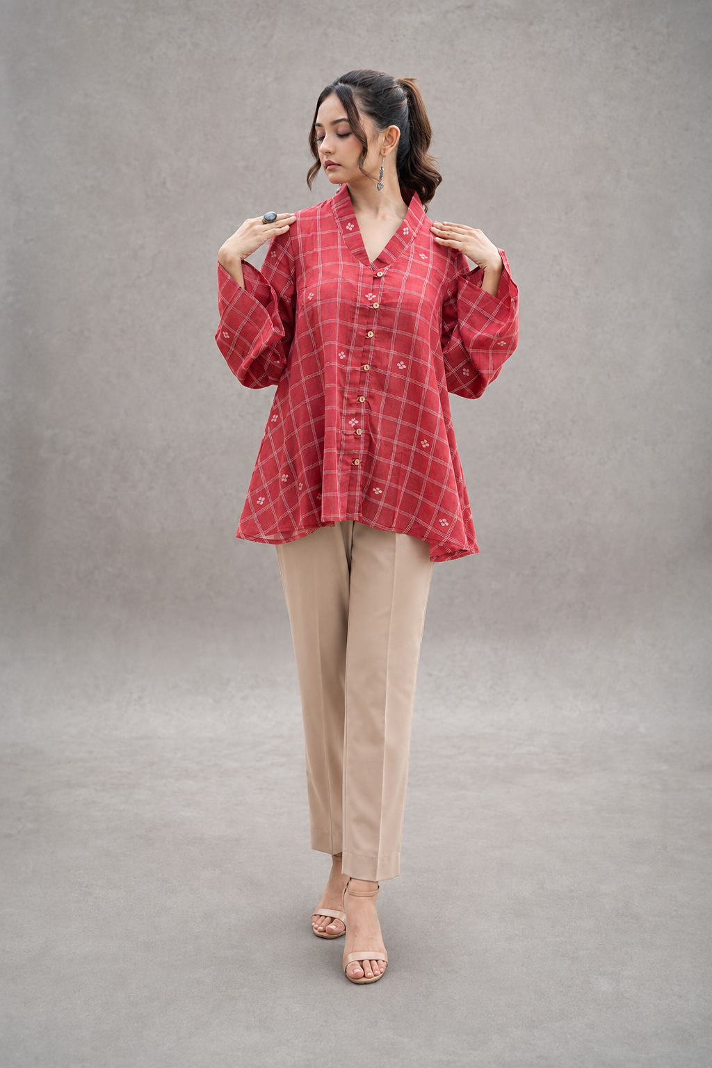 Red check Jamdani top showing handwoven cotton fabric detail